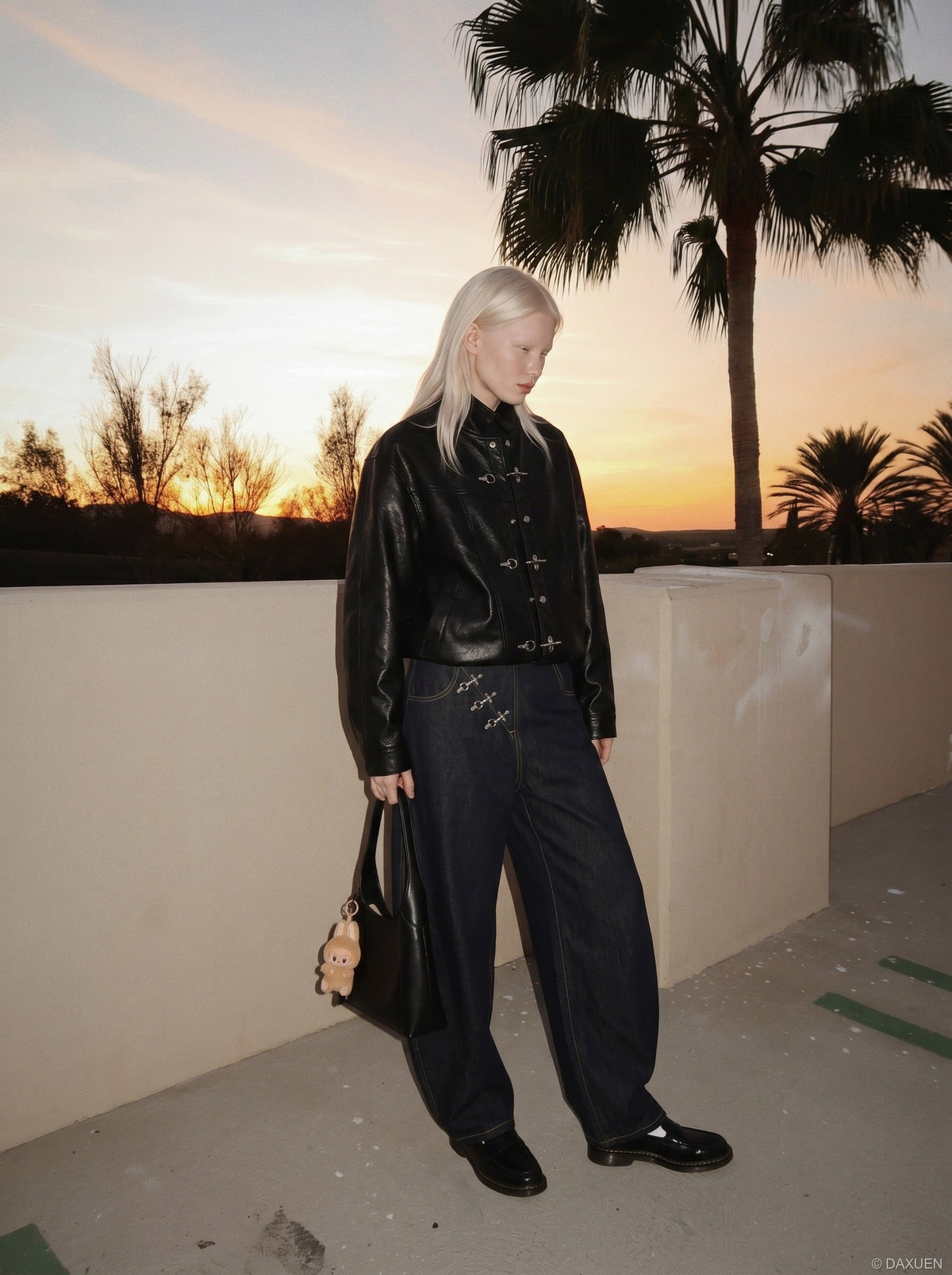 DAXUEN Wide-leg denim jeans with metal details — model photo
