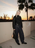 DAXUEN Wide-leg denim jeans with metal details — model photo