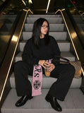DAXUEN Wide-leg pants with contrast sash and decorative graphics — model photo