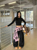 DAXUEN Wide-leg pants with contrast sash and decorative graphics — model photo