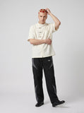 DAXUEN cream embossed butterfly pattern button-up shirt — model photo