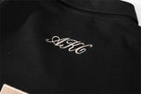 DAXUEN black oversized embroidered animal motif polo shirt