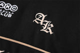 DAXUEN black oversized embroidered animal motif polo shirt