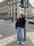 DAXUEN black embroidered BEFEARLE graphic hooded sweatshirt — model photo
