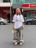 DAXUEN white oversized embroidered equestrian polo shirt — model photo