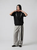 DAXUEN Embroidered short-sleeved knitted top — model photo