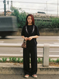 DAXUEN Embroidered short-sleeved knitted top — model photo