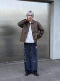 DAXUEN dark blue velvet embroidered script track pants — model photo