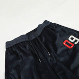 DAXUEN dark blue velvet embroidered script track pants