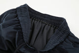 DAXUEN dark blue velvet embroidered script track pants