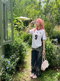 DAXUEN white short-sleeved soccer ball graphic jersey — model photo
