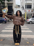 DAXUEN muted brown embroidered text corduroy baseball jacket — model photo