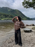 DAXUEN muted brown embroidered text corduroy baseball jacket — model photo