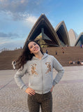 DAXUEN light grey quilted jacket with embroidered tigers — model photo