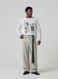 DAXUEN Graphic long sleeve t-shirt with text and designs — model photo