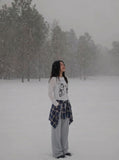 DAXUEN Graphic long sleeve t-shirt with text and designs — model photo