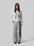 DAXUEN Graphic long sleeve t-shirt with text and designs — model photo