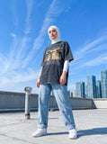 DAXUEN dark grey oversized eyes and crucifix graphic tee — model photo