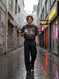 DAXUEN dark grey oversized eyes and crucifix graphic tee — model photo