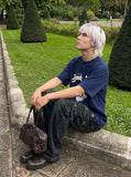 DAXUEN Oversized Playful Puppy Graphic Tee — model photo