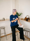 DAXUEN Oversized Playful Puppy Graphic Tee — model photo