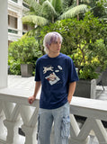DAXUEN Oversized Playful Puppy Graphic Tee — model photo