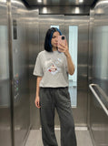 DAXUEN Oversized Playful Puppy Graphic Tee — model photo