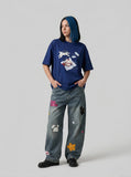 DAXUEN Oversized Playful Puppy Graphic Tee — model photo