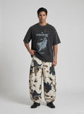 DAXUEN washed black oversized abstract graphic tee — model photo