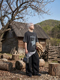 DAXUEN washed black oversized abstract graphic tee — model photo