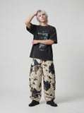DAXUEN washed black oversized abstract graphic tee — model photo