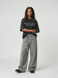 DAXUEN faded black text graphic oversized t-shirt — model photo