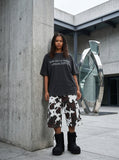 DAXUEN faded black text graphic oversized t-shirt — model photo