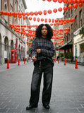 DAXUEN faded black wide-leg denim jeans with charm — model photo