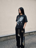 DAXUEN faded black winged angel graphic t-shirt — model photo