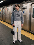DAXUEN faded blue wide-leg denim trousers — model photo