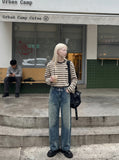 DAXUEN faded blue wide-leg denim trousers — model photo