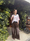 DAXUEN faded brown straight-leg casual pants with plaid waistband — model photo