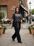 DAXUEN faded dark charcoal vintage text graphic t-shirt — model photo