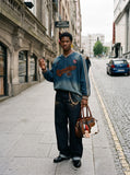 DAXUEN faded denim gradient oversized long-sleeve top — model photo