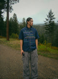 DAXUEN Short-sleeved faded denim shirt with graphic text — model photo