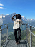 DAXUEN light grey oversized faded-checkered-flag graphic t-shirt — model photo