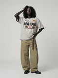 DAXUEN light grey oversized faded-checkered-flag graphic t-shirt — model photo