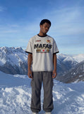 DAXUEN light grey oversized faded-checkered-flag graphic t-shirt — model photo