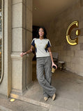 DAXUEN washed grey wide-leg cargo pants with flap pockets — model photo