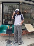 DAXUEN washed grey wide-leg cargo pants with flap pockets — model photo