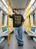 DAXUEN faded charcoal oversized grid graphic tee — model photo