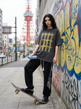 DAXUEN faded charcoal oversized grid graphic tee — model photo