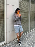 DAXUEN light blue faded denim shorts — model photo