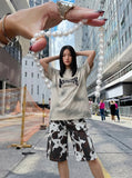 DAXUEN Faded crew neck t-shirt with 'MENTALITY' embroidery — model photo